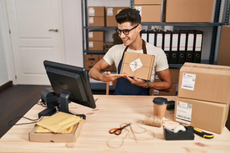 Ecommerce fulfillment worker inspecting a packaged kit ready for shipping.